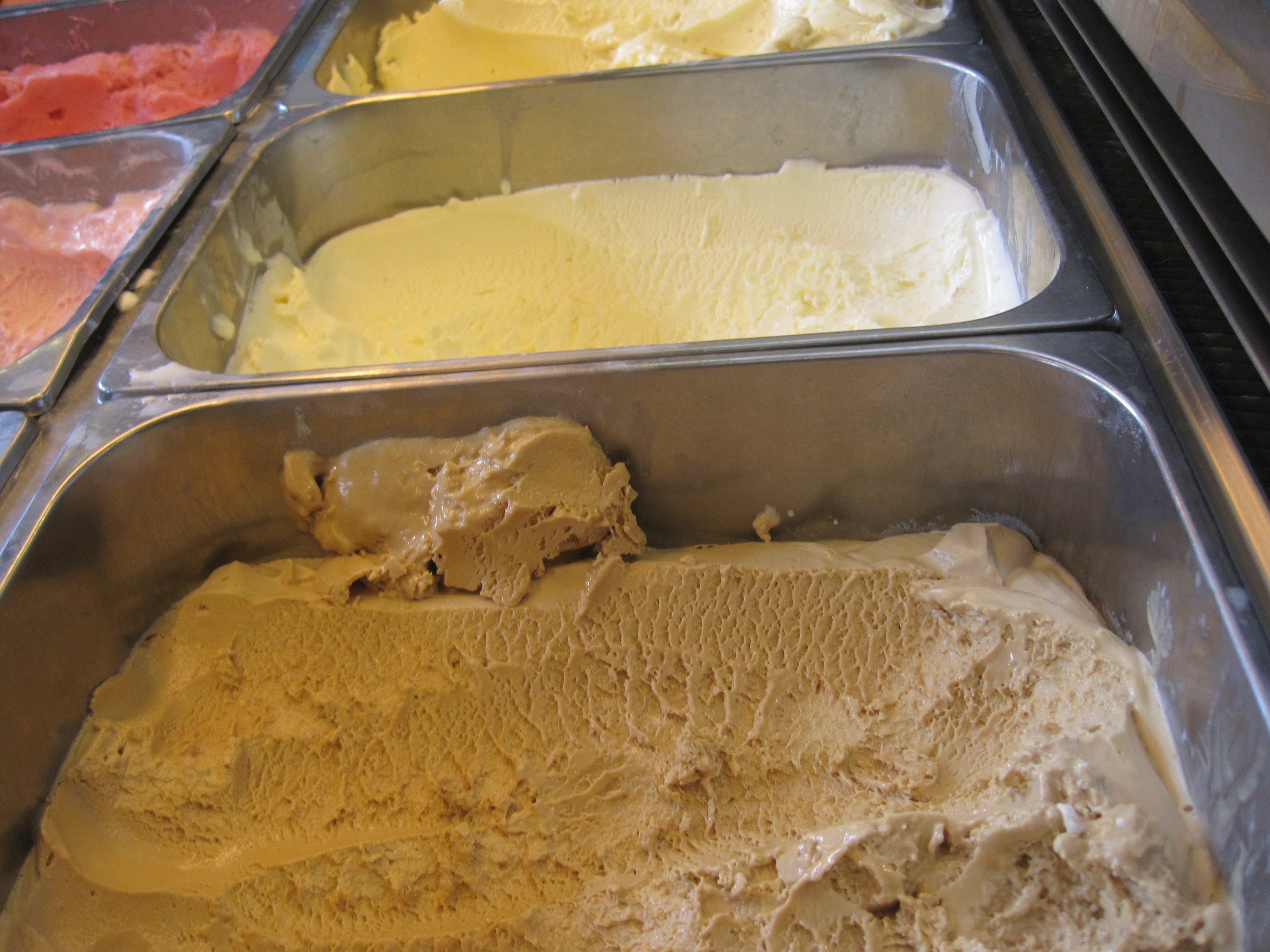Creamy ice cream flavors in display case